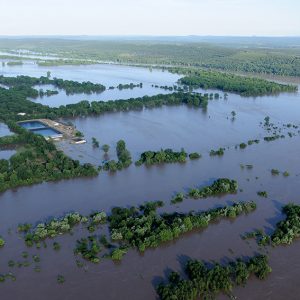 Flooded area with trees and two pools as seen from above