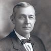 Portrait white man in suit and bow tie