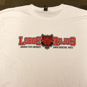 White shirt with red and black "Lobos Rojos" in its center