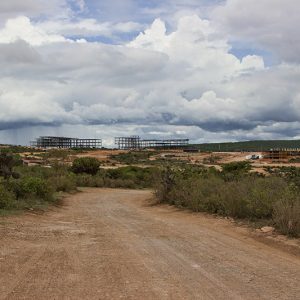 Multistory buildings under construction in desert landscape