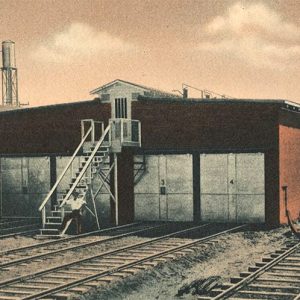 Industrial buildings with railroad tracks in front of them