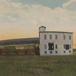 Long multistory building adjacent to railroad track