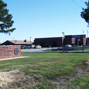 Brick buildings parking lot and sign