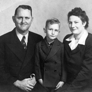 White man boy and woman smiling in suits