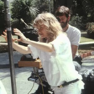 White woman and cameraman on set