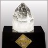 Large pointed crystal on black display base with diamond shaped gold badge and engraved name plate