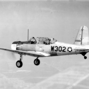 Propeller-driven airplane in flight with landing gear engaged