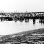 Steel railroad bridge across a river