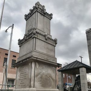 Multitiered castle like monument with engraved top and base panels