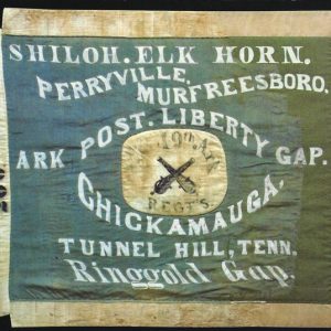 Bluish green and white flag with white text and crossed cannons in the center saying "Shiloh Elk Horn Perryville Murfreesboro Ark Post Liberty Gap Chickamauga Tunnel Hill, Tenn. Ringgold Gap"