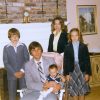 White man woman and children in living room