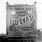 Large sign advertising Bella Vista including directions