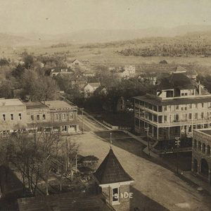 Multistory buildings on street in town as seen from above