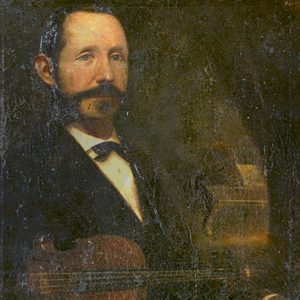 Portrait of white man with mustache in suit holding a violin