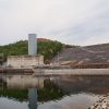 Concrete dam and buildings with power station on water