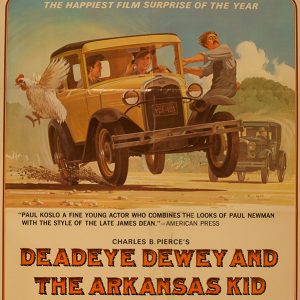 Movie poster featuring young white men driving yellow car with young white man hanging off its side in front of white man in black car