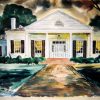 Single-story house with covered porch and walking path in front yard with trees