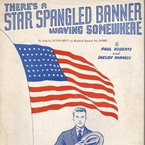 White man in suit with hat over his heart below American flag drawing and text on sheet music cover