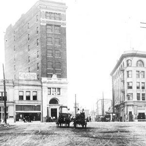 Street scene featuring tall buildings and cars