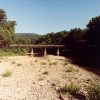 Side view of concrete bridge over river