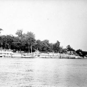 House boats tied to the docks along a river