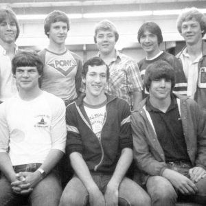 Group of eight white boys in library