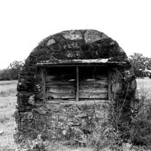 Stone message board wall in field