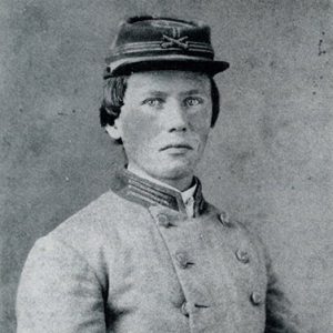 Young white man in gray military uniform