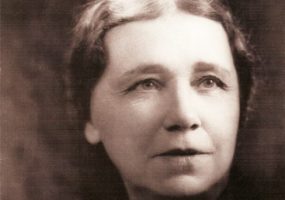 White woman with brooch and "Hattie W Caraway" text