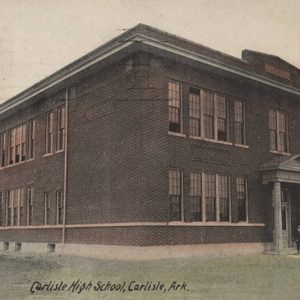 Multistory building with covered entrance supported by two columns