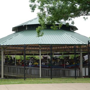 Carousel behind fence