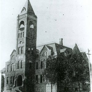 Multistory building with arched windows and bell tower