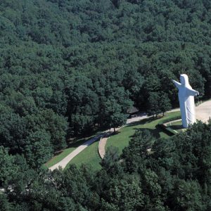 Jesus statue and park overhead view with surrounding forest