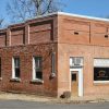 Brick storefront building on street corner