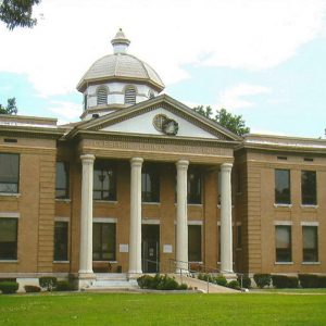 Multistory building with four front columns and dome