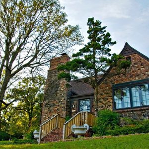 Brick house with chimney on grass