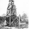 White woman and wooden bell tower