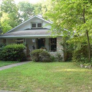 Single-story house with covered porch and brick columns