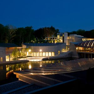 Modern building with reflecting pool at night