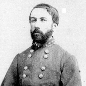 White man with beard in gray military uniform