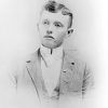 Young white man in suit and tie