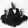 Portrait three white men in suits each with short hair and beards solemn expressions