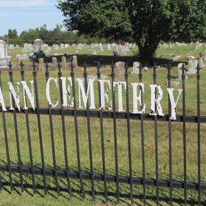 Iron fence with "De Ann Cemetery" painted on it