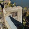 "Departee Creek Relief 1976" plaque on bridge