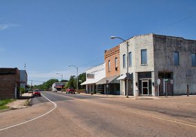 Single and multistory storefronts on two-lane street