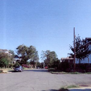 Multistory houses and tress on street in residential neighborhood