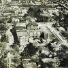 aerial view of large multistory complex in middle of neighborhood