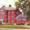 Colored drawing of a three-story red brick building with curved driveway and trees