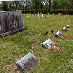 Weathered gravestones in cemetery