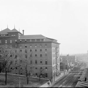 Multi-story building with people on street